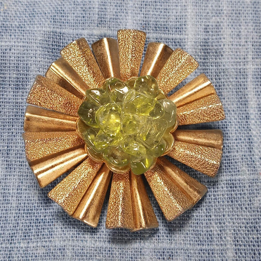 1960s Vintage Pin with a Gold Tone Starburst and Peridot Center