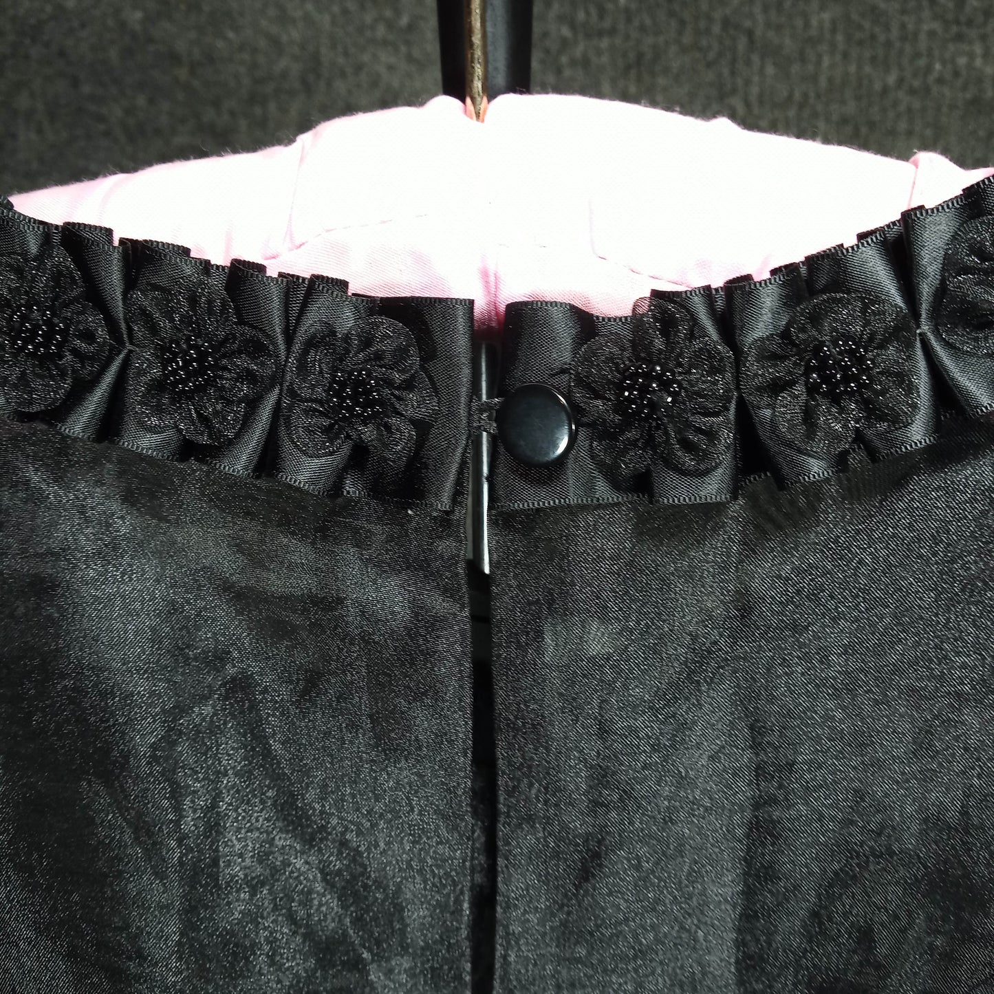 1950's Black Silk/Satin Peplum Wiggle Dress with an Organa Flower Bodice