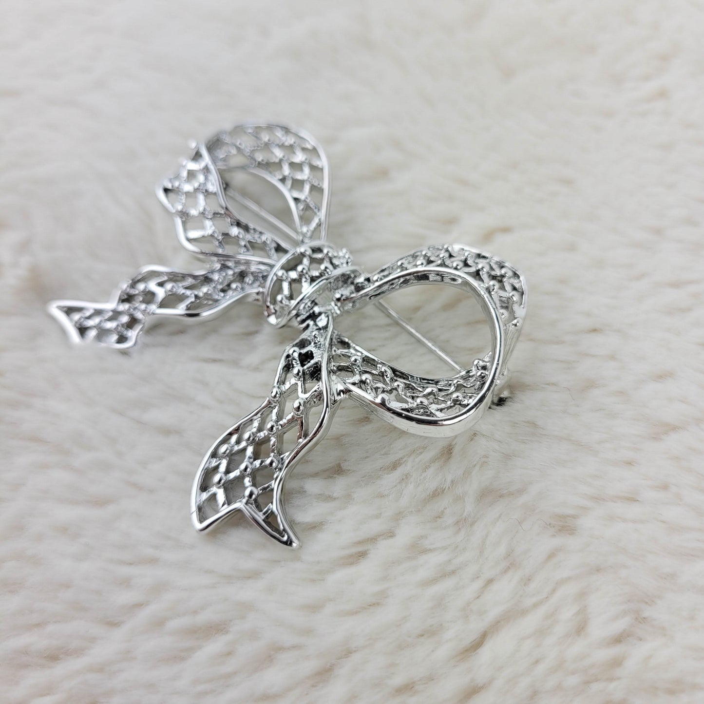 1960's Silver Tone Metal Filigree Bow Pin