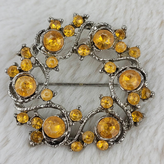 1970's Vintage Silver Tone Metal and Yellow Rhinestone Circular Pin