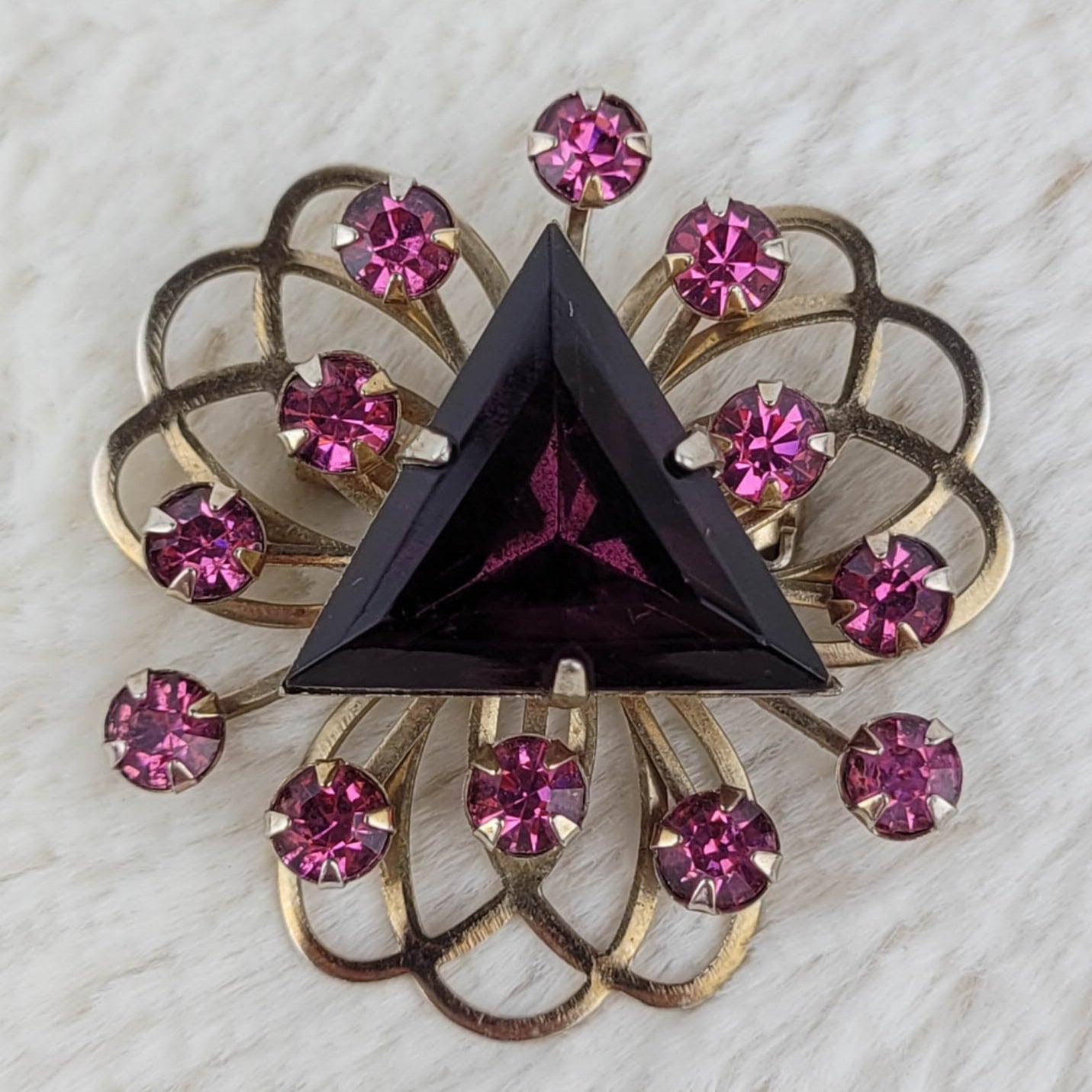 1950's Triangular Purple Rhinestone Swirling Gold Tone Metal Tone Pin