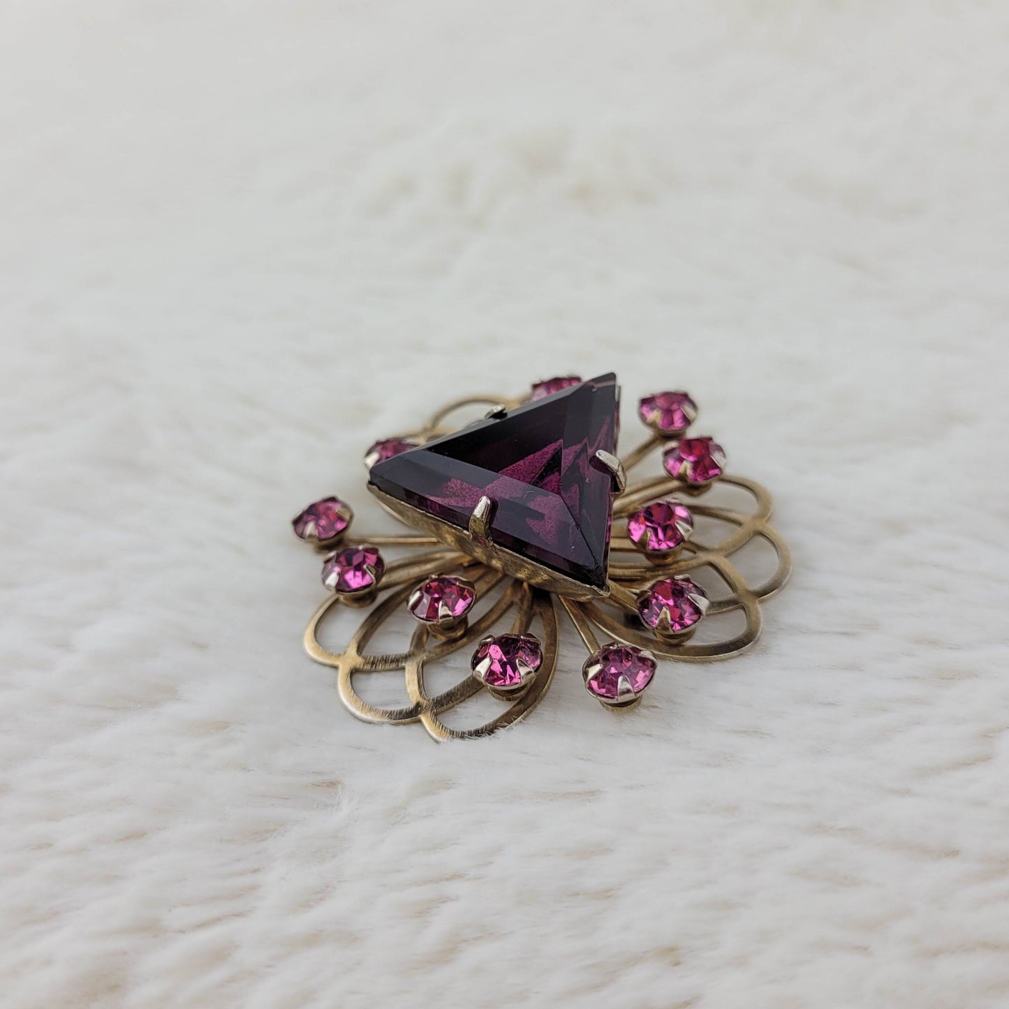 1950's Triangular Purple Rhinestone Swirling Gold Tone Metal Tone Pin