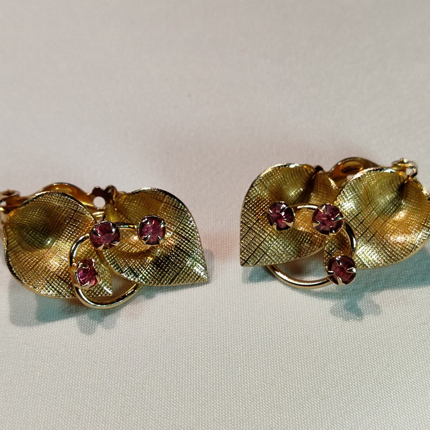 1960's Gold Tone Metal Leaves and Plumb Rhinestone Clip Earrings