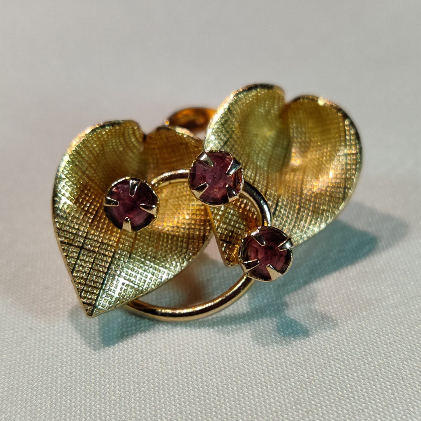 1960's Gold Tone Metal Leaves and Plumb Rhinestone Clip Earrings