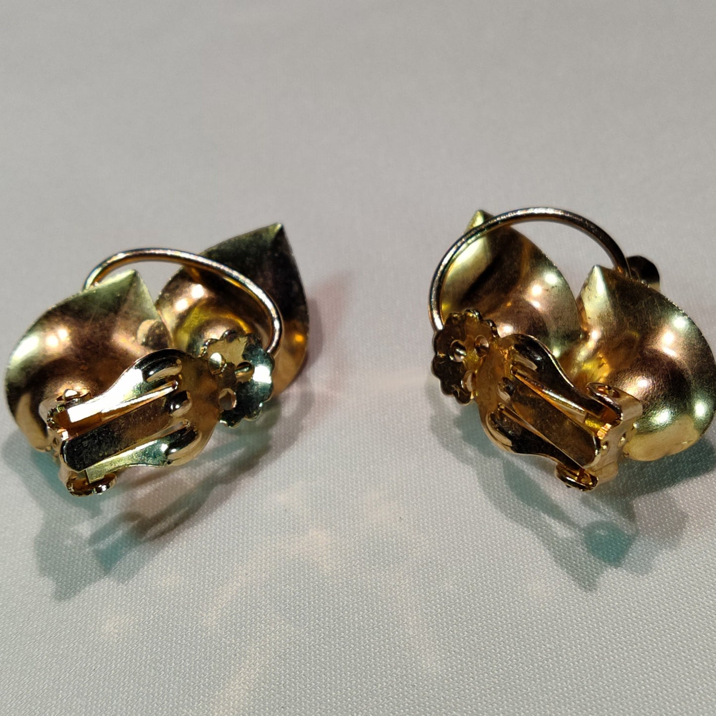 1960's Gold Tone Metal Leaves and Plumb Rhinestone Clip Earrings