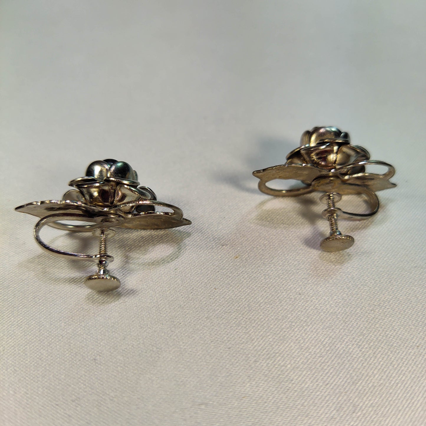 1960's Screwback Silver Tone Metal Flower Earrings with a Rhinestone Center