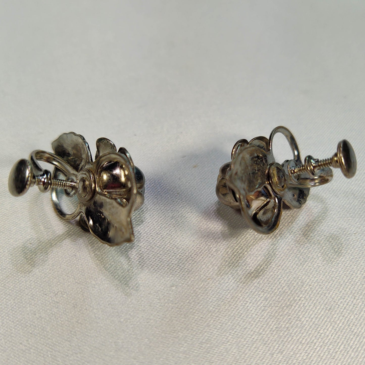 1960's Screwback Silver Tone Metal Flower Earrings with a Rhinestone Center