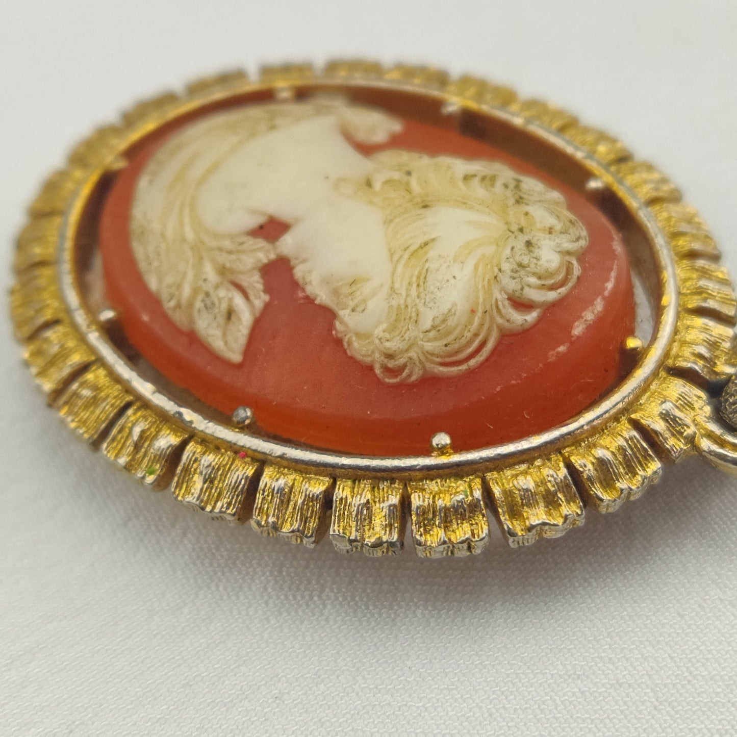 1950's White on Red Bakelite Cameo Pendant in a Gold Tone Frame