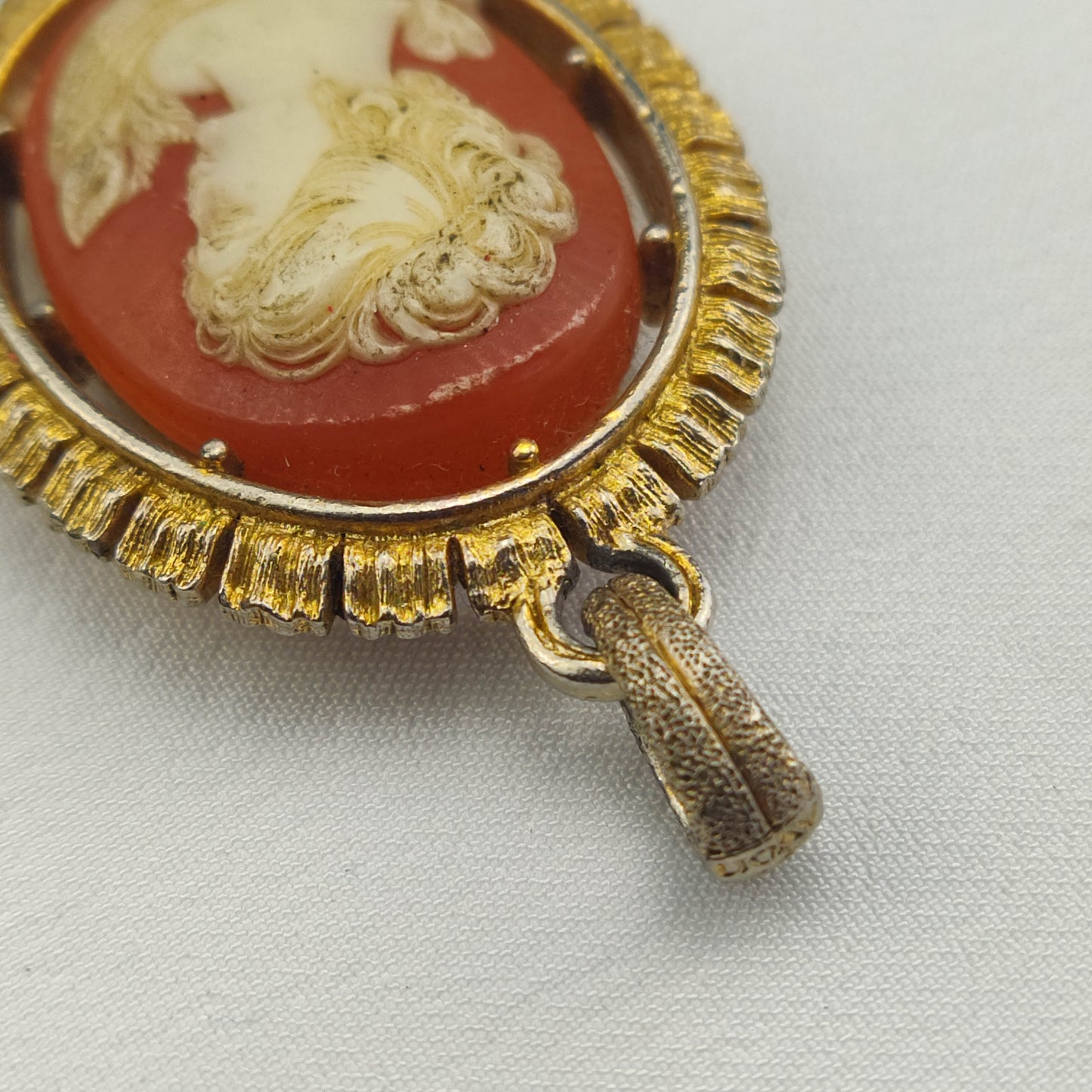 1950's White on Red Bakelite Cameo Pendant in a Gold Tone Frame