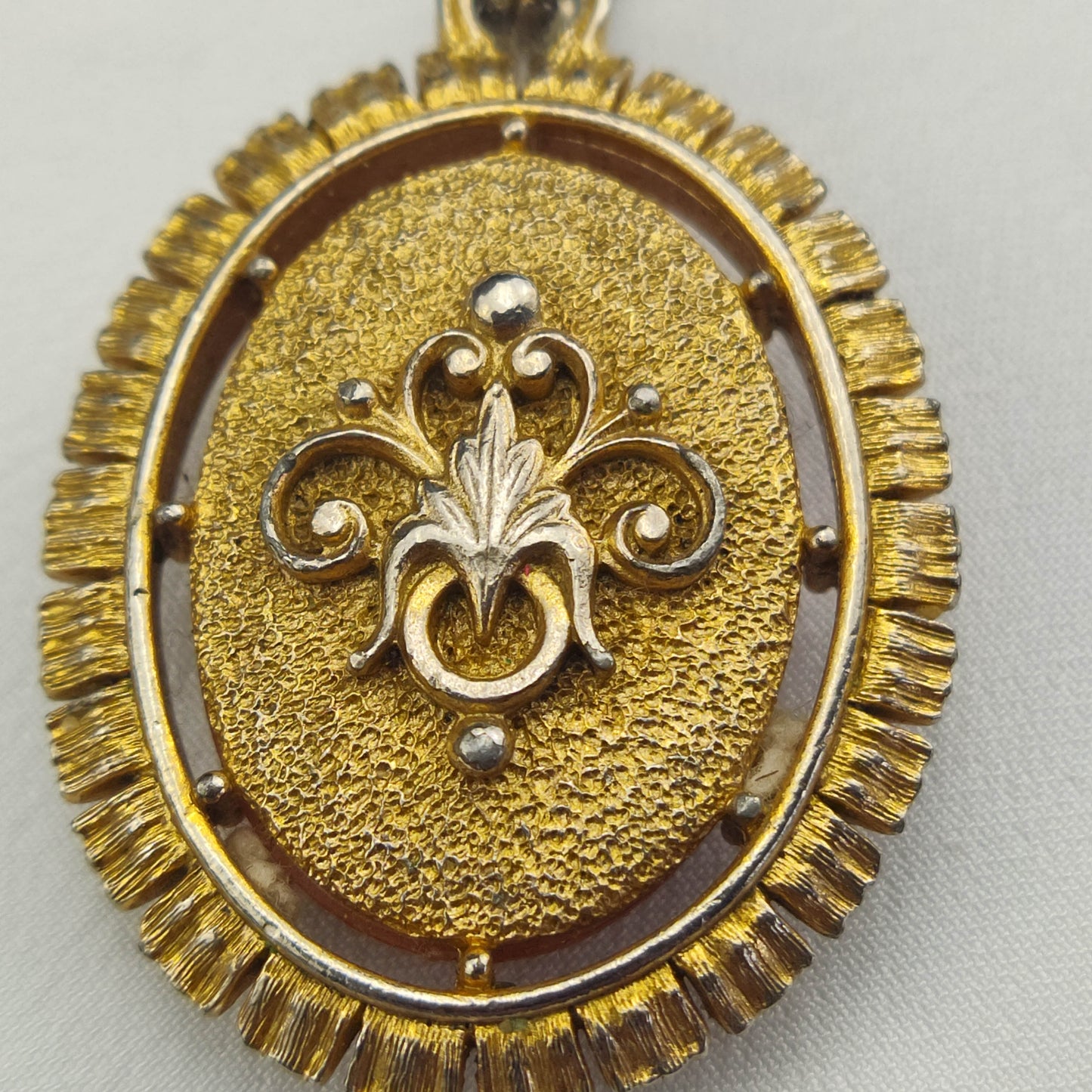 1950's White on Red Bakelite Cameo Pendant in a Gold Tone Frame