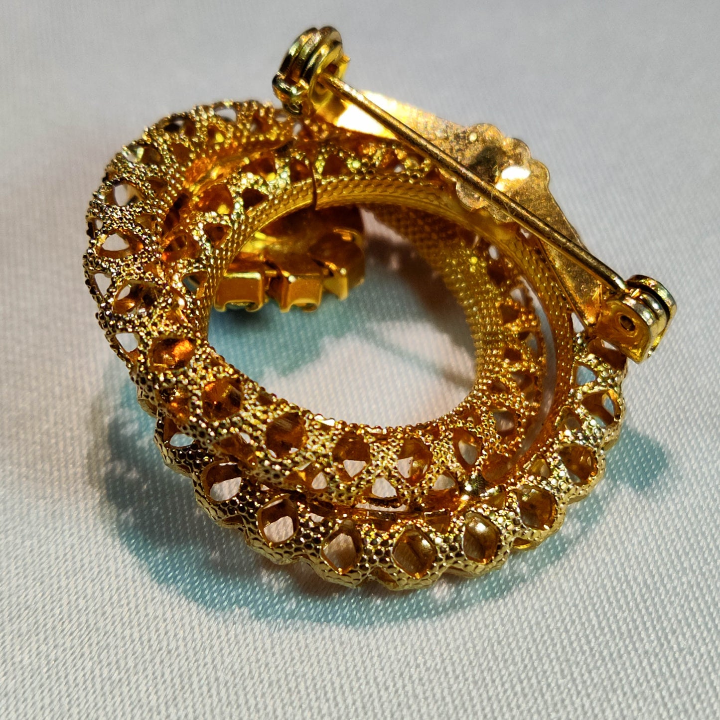 1960's Gold Tone Metal Filigree and Green Rhinestone Pin