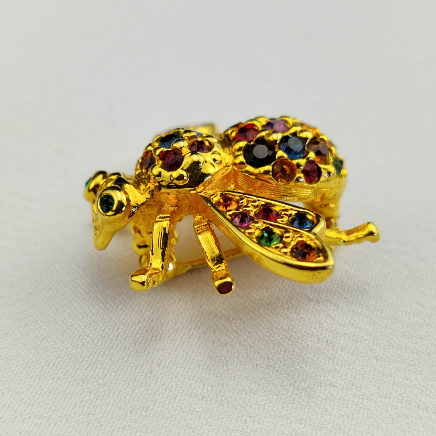 1970's Gold Tone Bug Pin with Multi-Colored Rhinestones