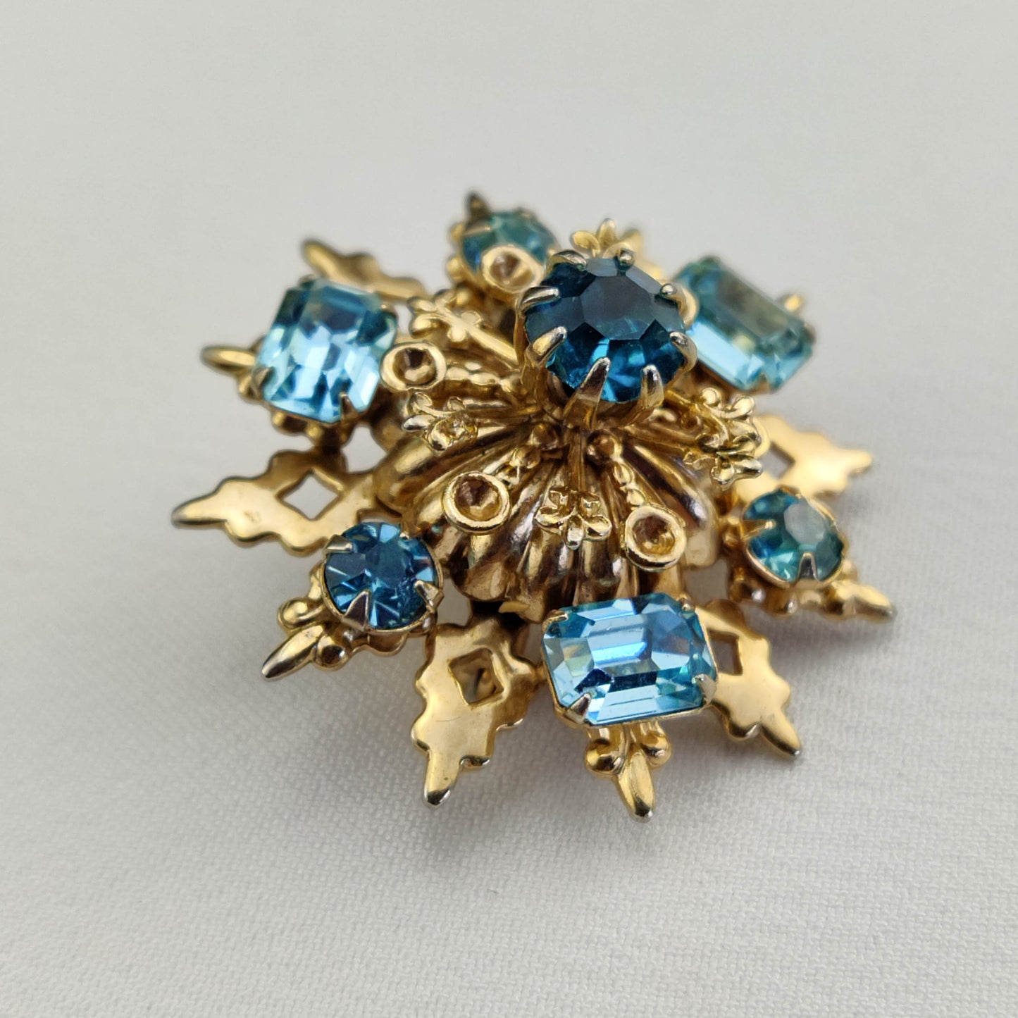 1950's Gold Tone Filigree Blue Rhinestone Star Pin