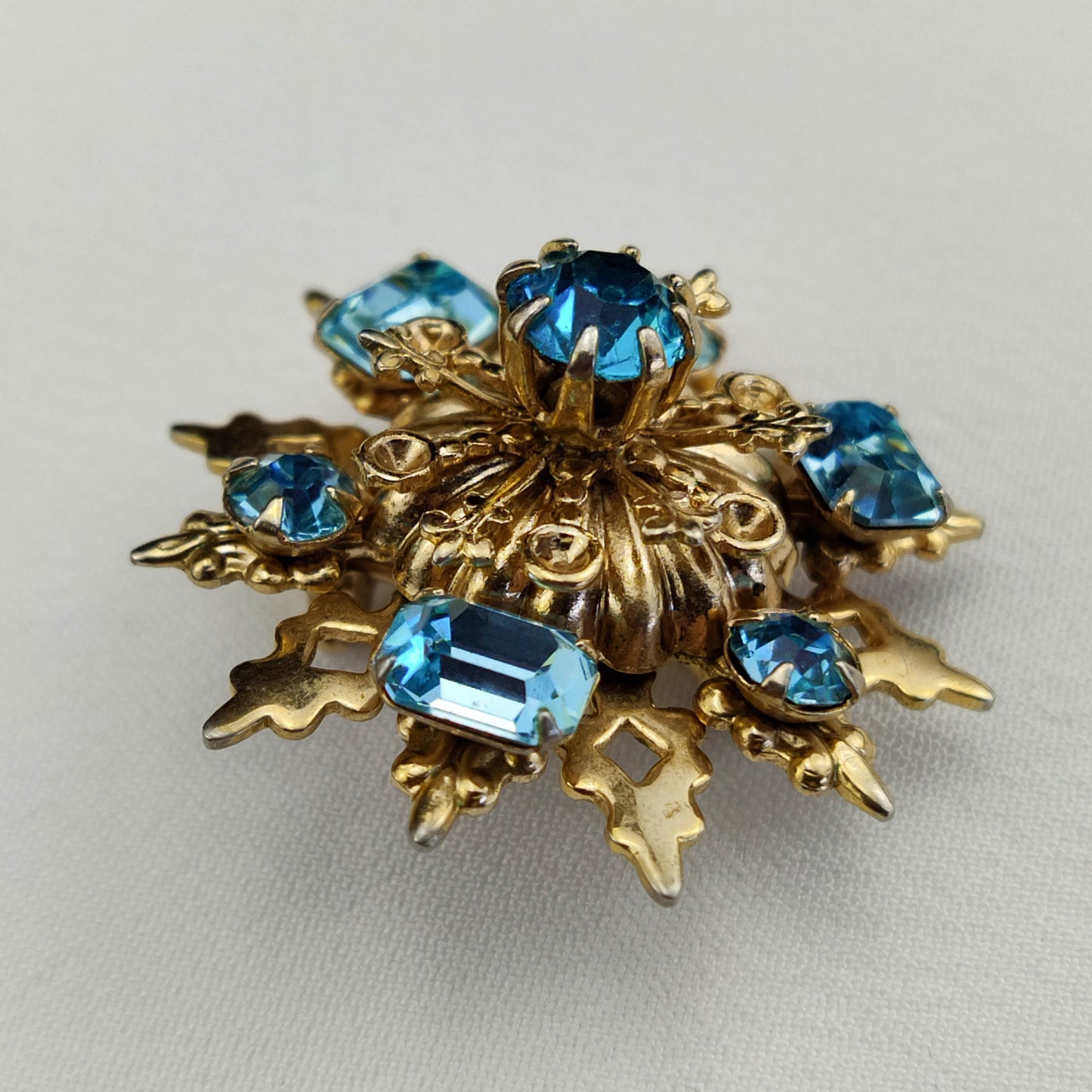 1950's Gold Tone Filigree Blue Rhinestone Star Pin