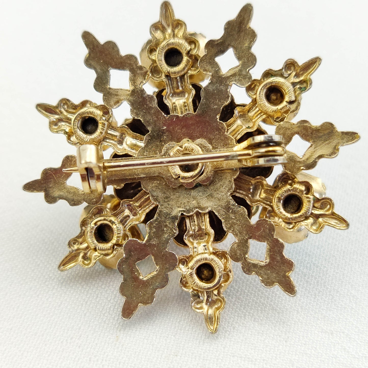 1950's Gold Tone Filigree Blue Rhinestone Star Pin