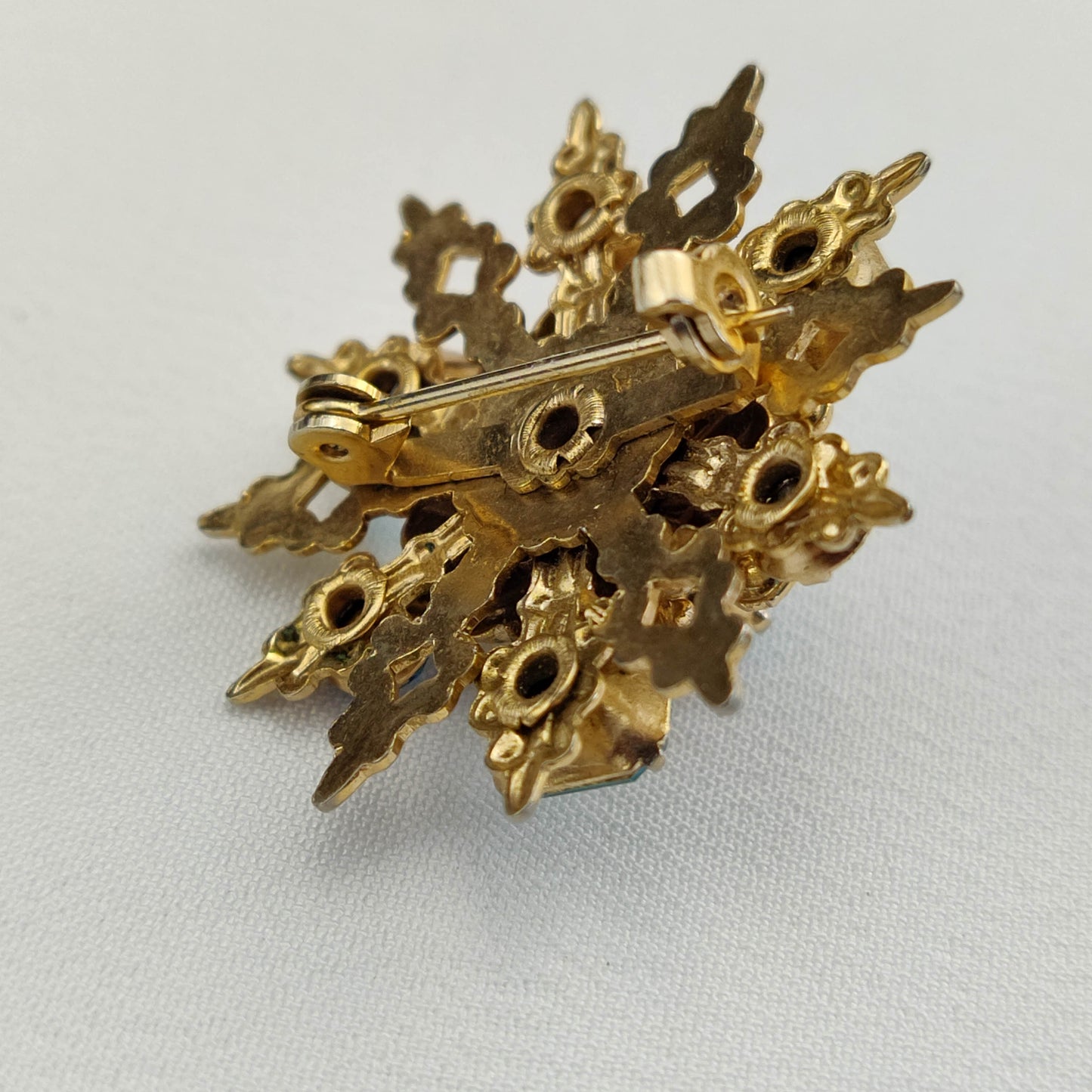 1950's Gold Tone Filigree Blue Rhinestone Star Pin