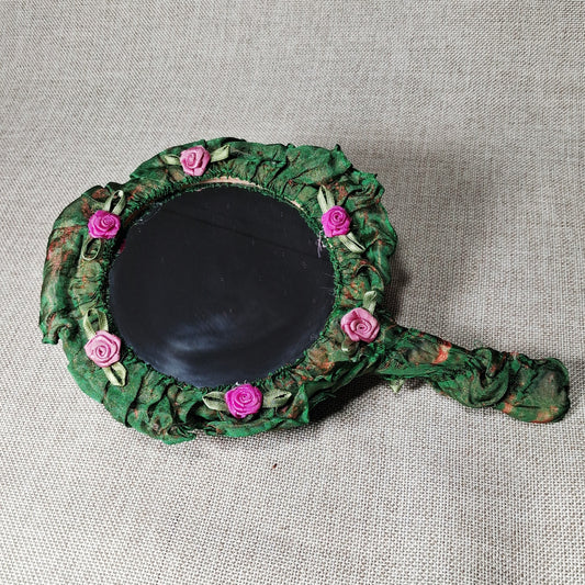 Vintage Hand Mirror: Unique and Hand Made with Fabric Roses on a Green Background
