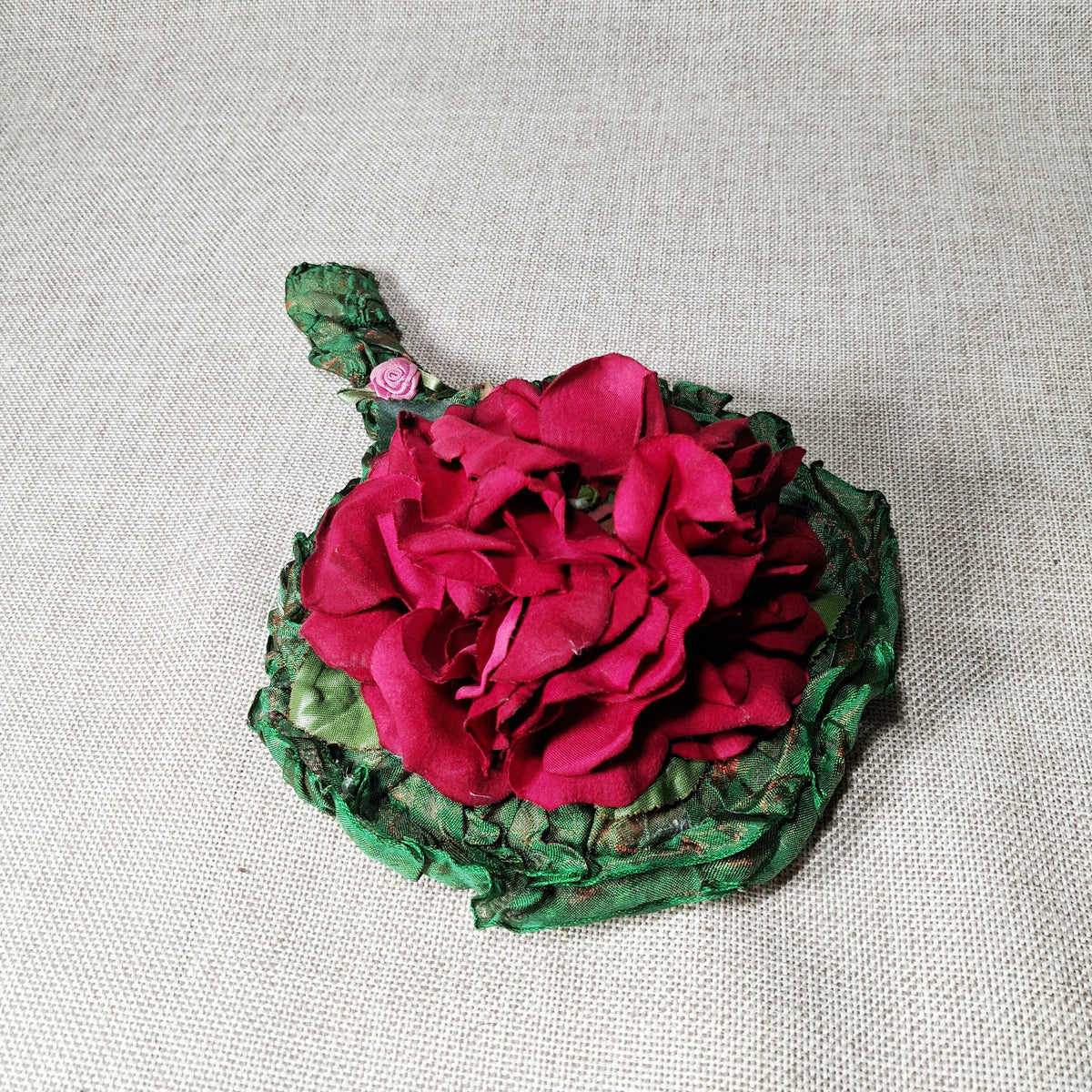 Vintage Hand Mirror: Unique and Hand Made with Fabric Roses on a Green Background