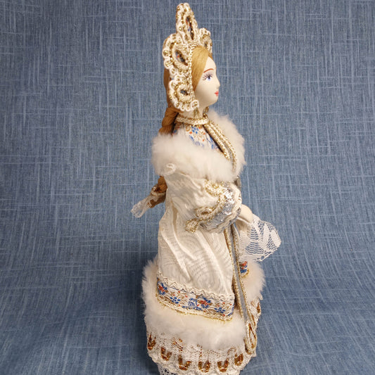 Vintage Porcelain Figurine: White and Blue in Traditional Dress