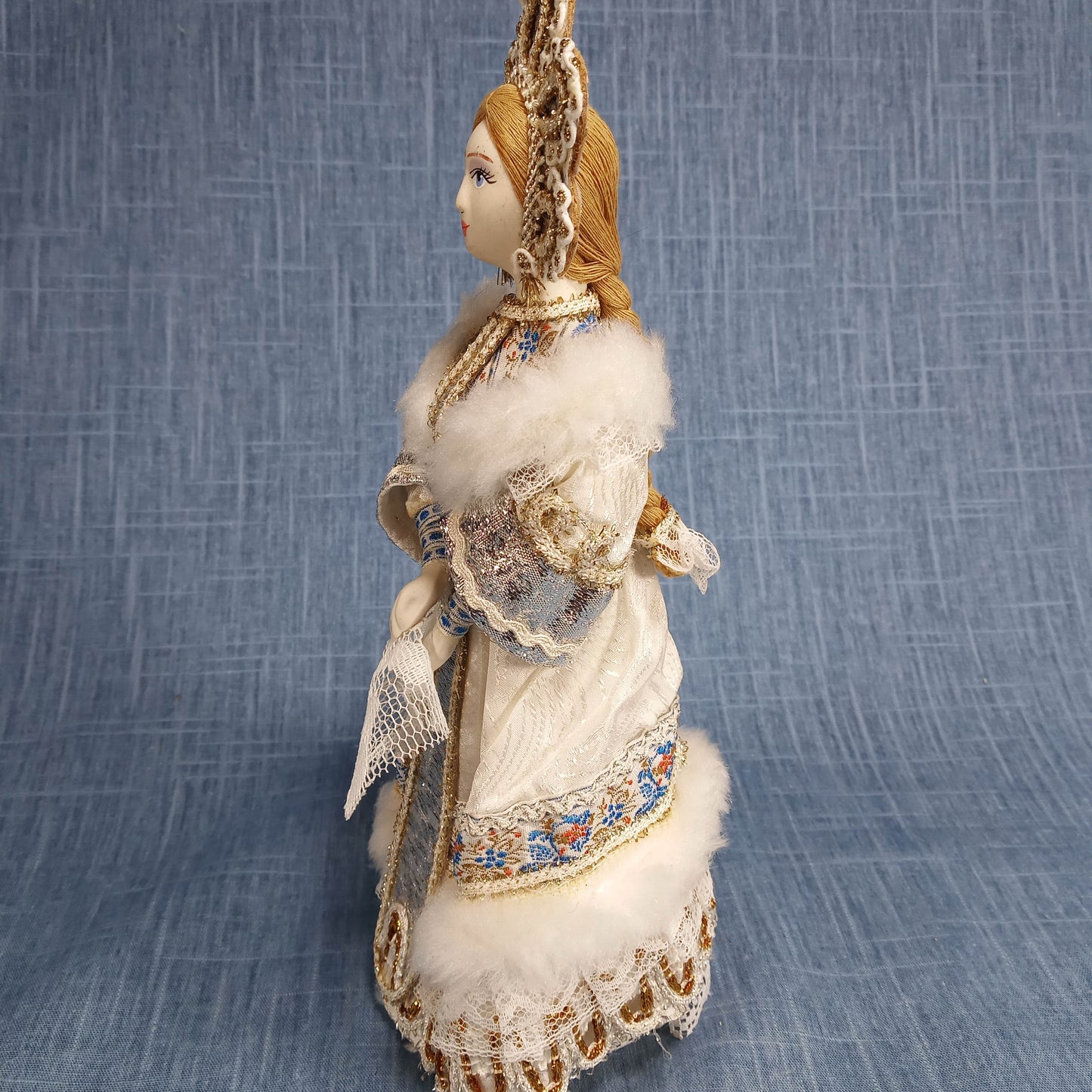 Vintage Porcelain Figurine: White and Blue in Traditional Dress