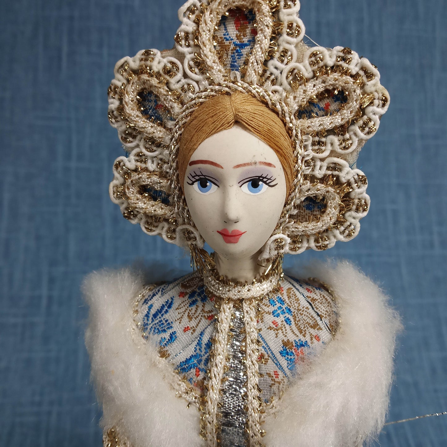 Vintage Porcelain Figurine: White and Blue in Traditional Dress