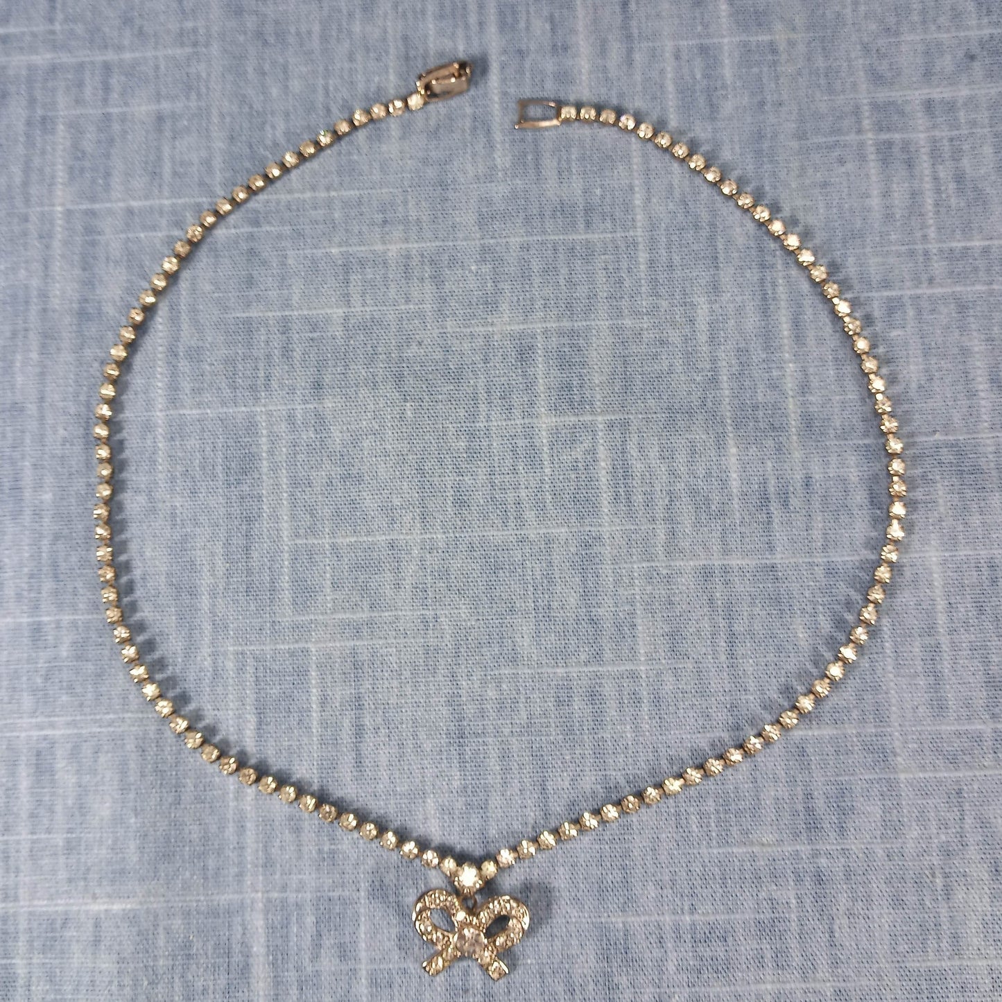 1990s Vintage Necklace with Clear Rhinestones and a Rhinestone Bow Pendant