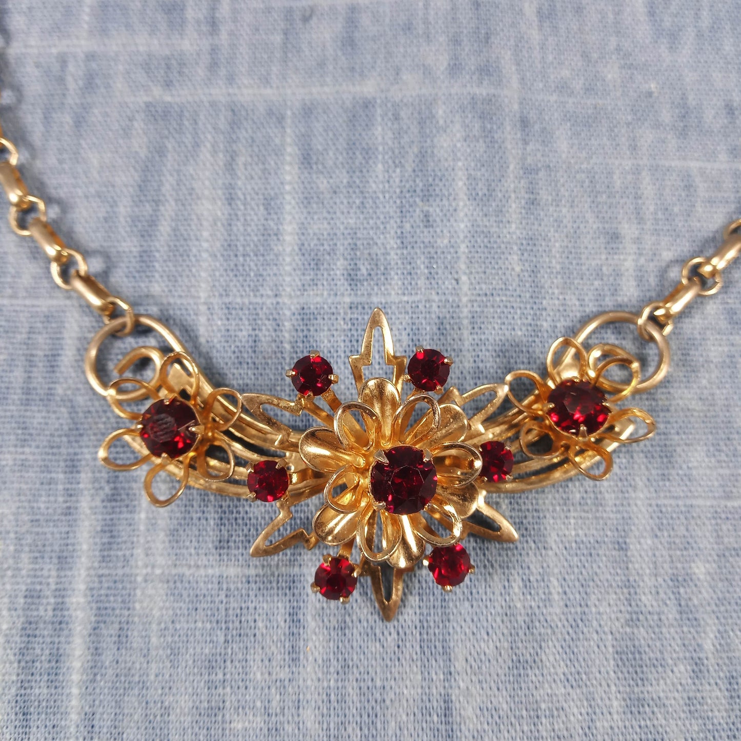 1970s Vintage Necklace with Gold Tone Winged Metal and Red Rhinestones