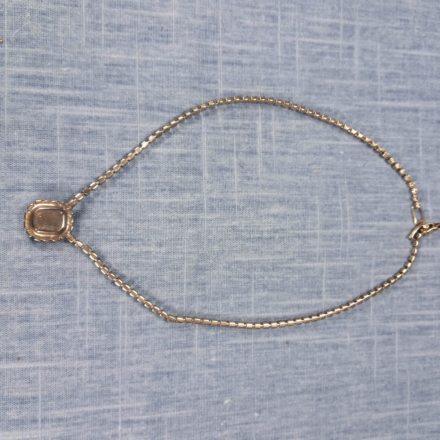1980s Vintage Necklace with a Single Strand of Clear Rhinestones and Red Pendant