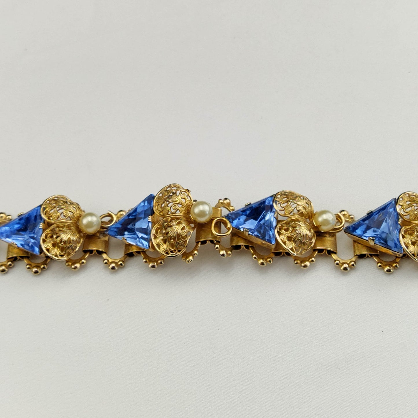 1950's Blue Trillion Cut Crystals and Faux Pearls in Gold Metal Tone