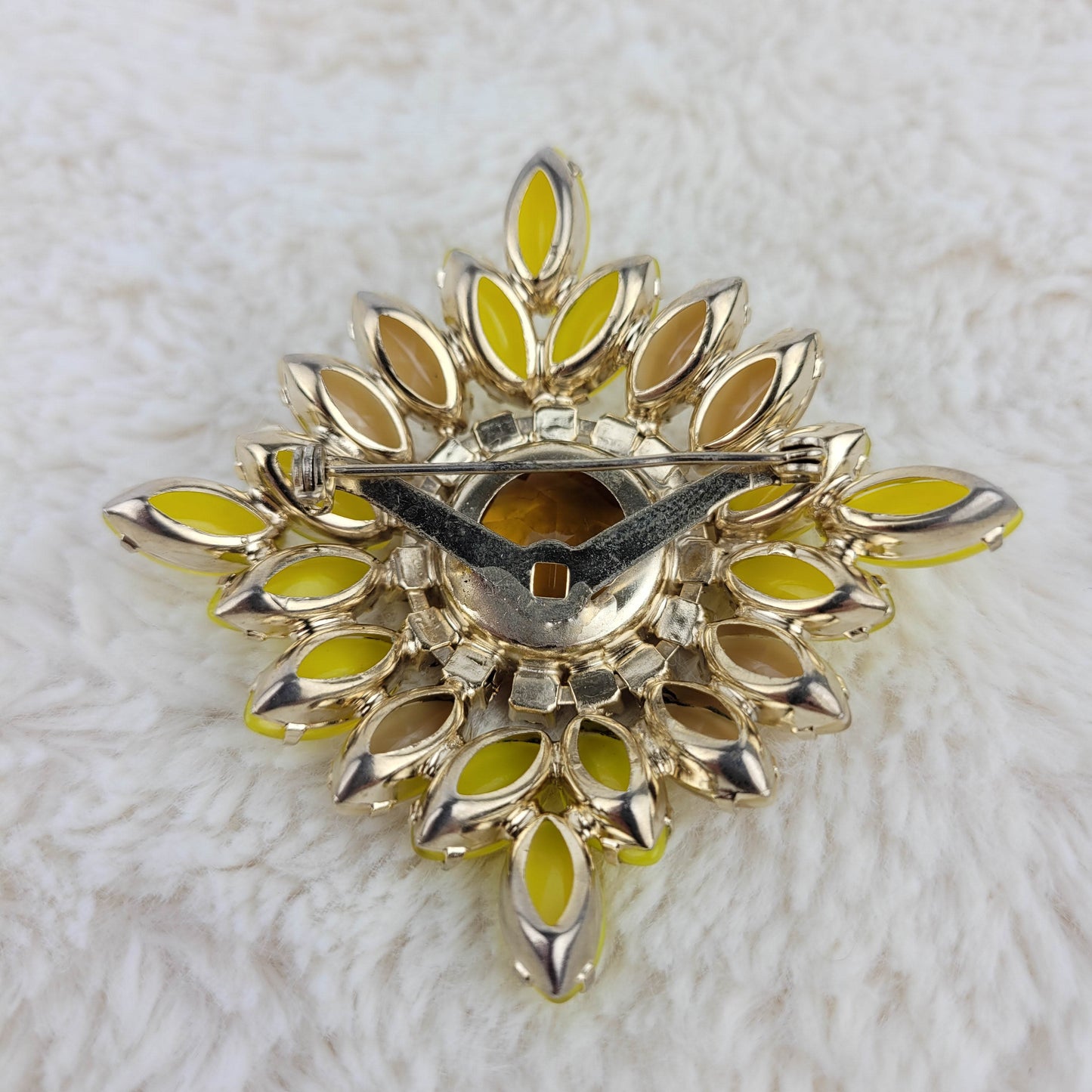 1950's Bronze and Yellow Rhinestone Pin with an Amber Glass Center Cut