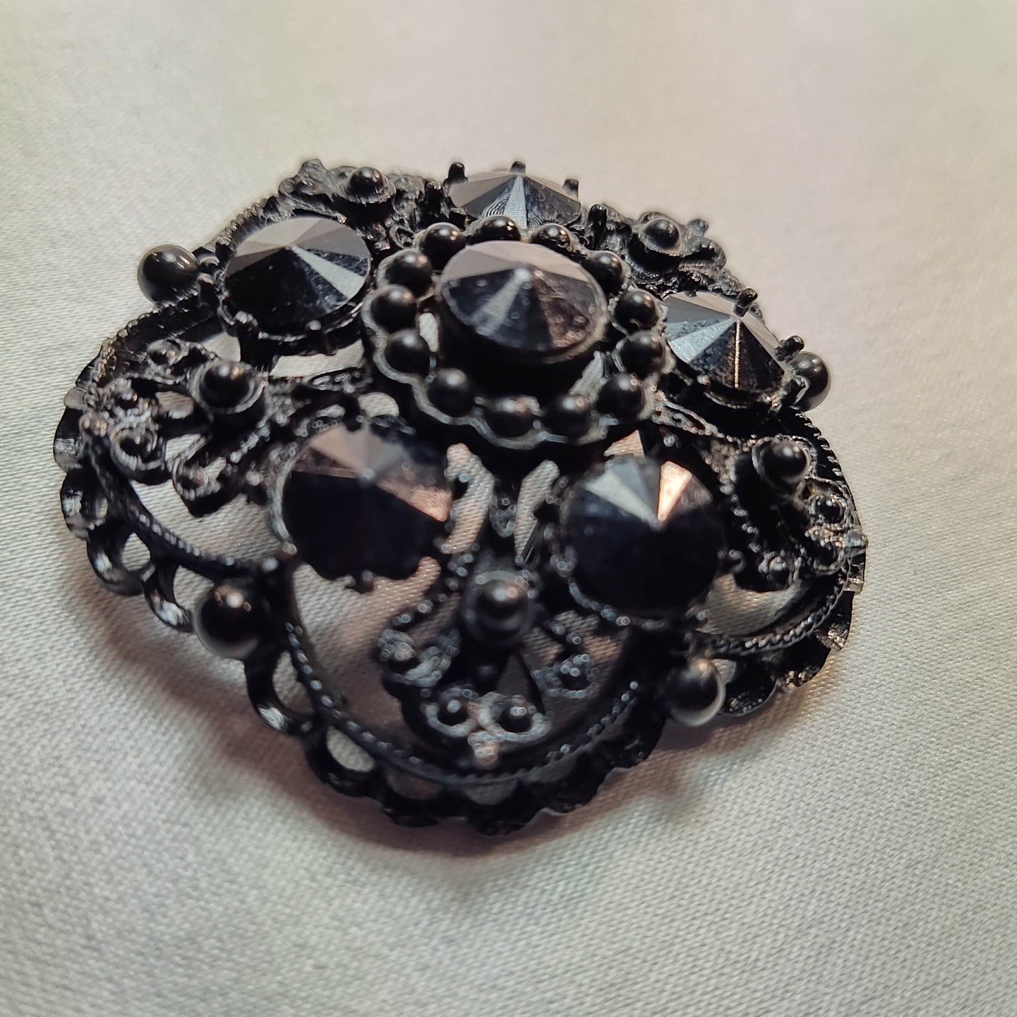 1940's Black Rhinestone on Black Metal Brooch by Weiss