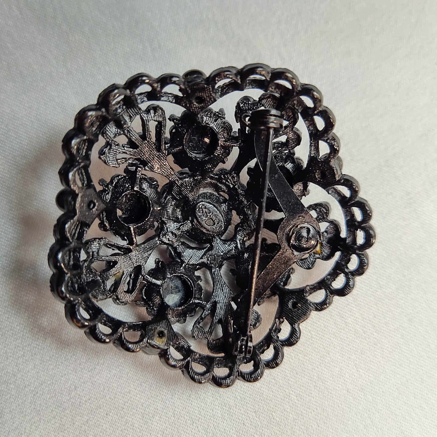 1940's Black Rhinestone on Black Metal Brooch by Weiss