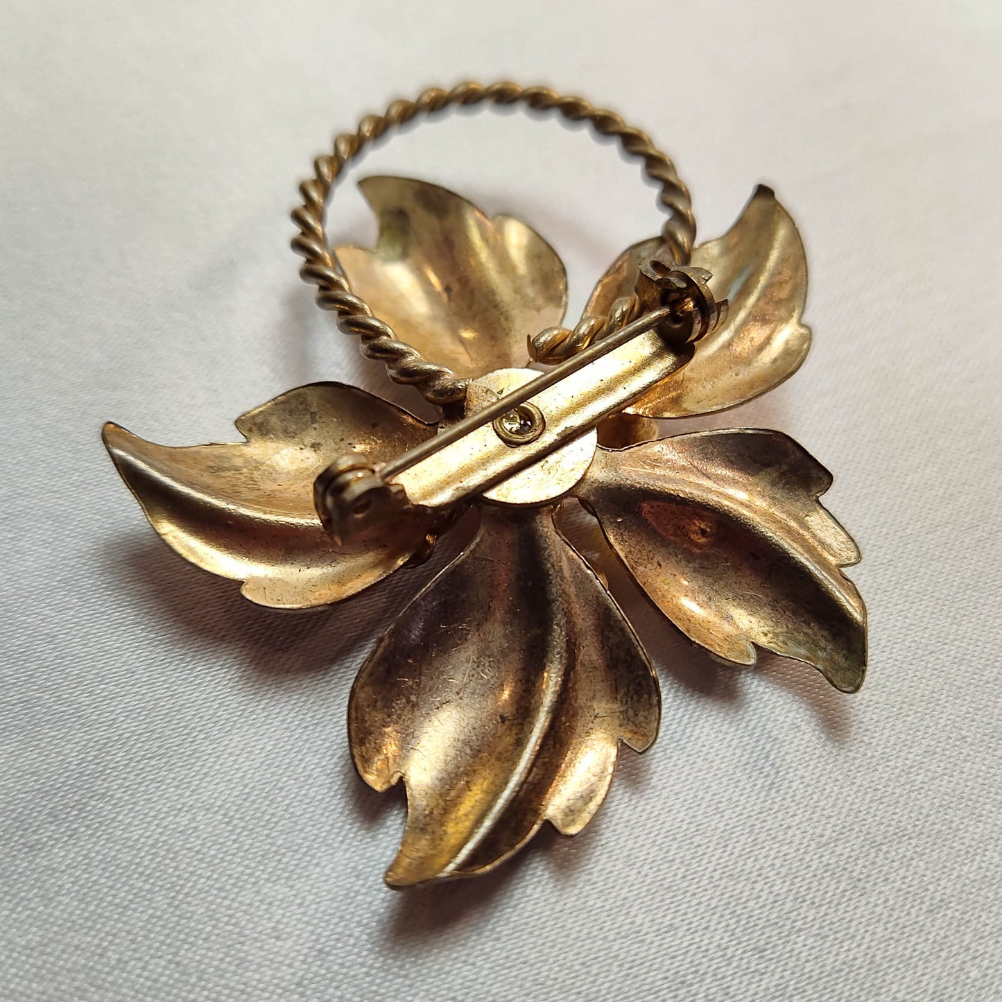 1970's Bronze Metal Flower Pin with a Pink Center Rhinestone