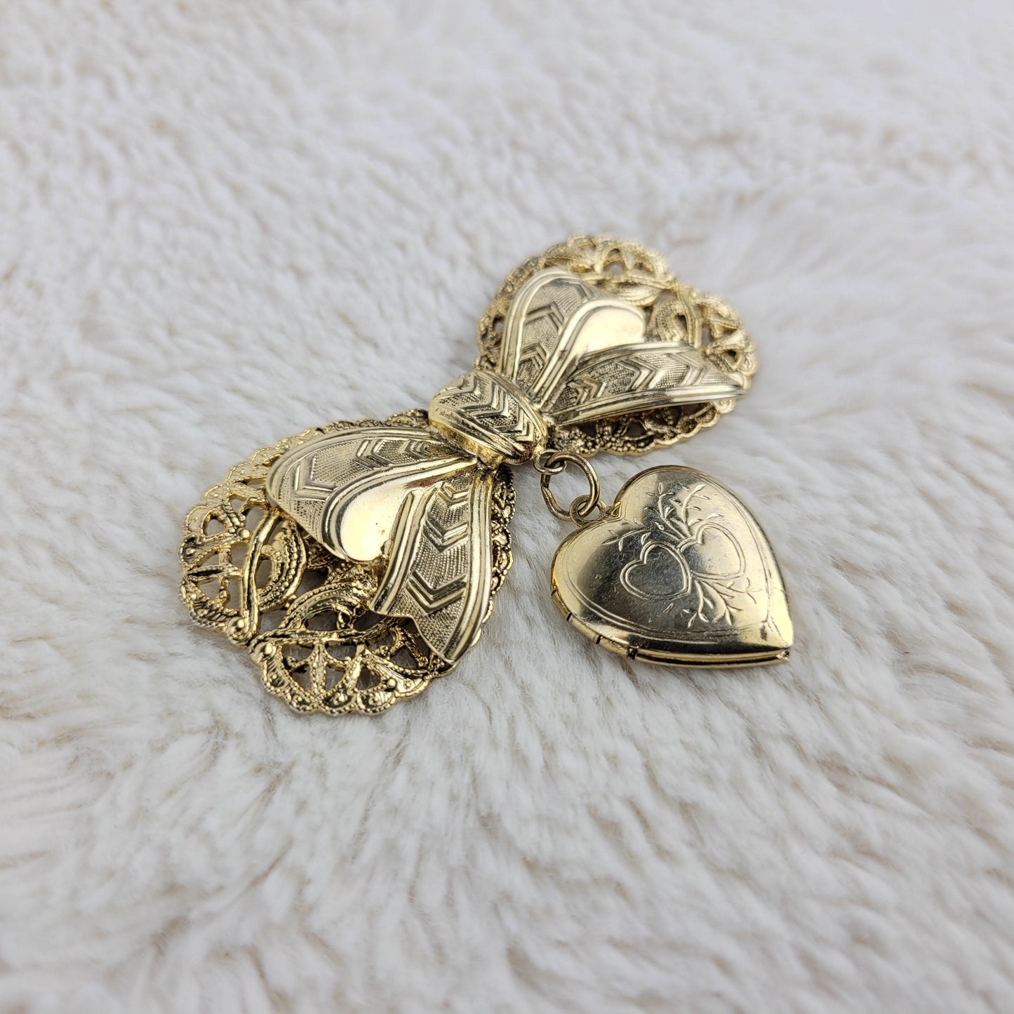 1950's Gold Tone Metal Filigree Bow with Heart Locket Pin