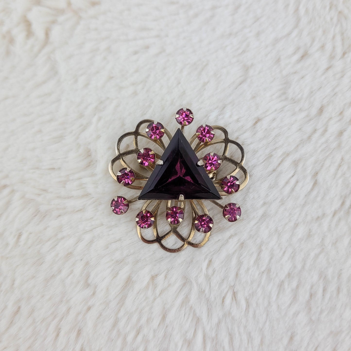 1950's Triangular Purple Rhinestone Swirling Gold Metal Tone Pin