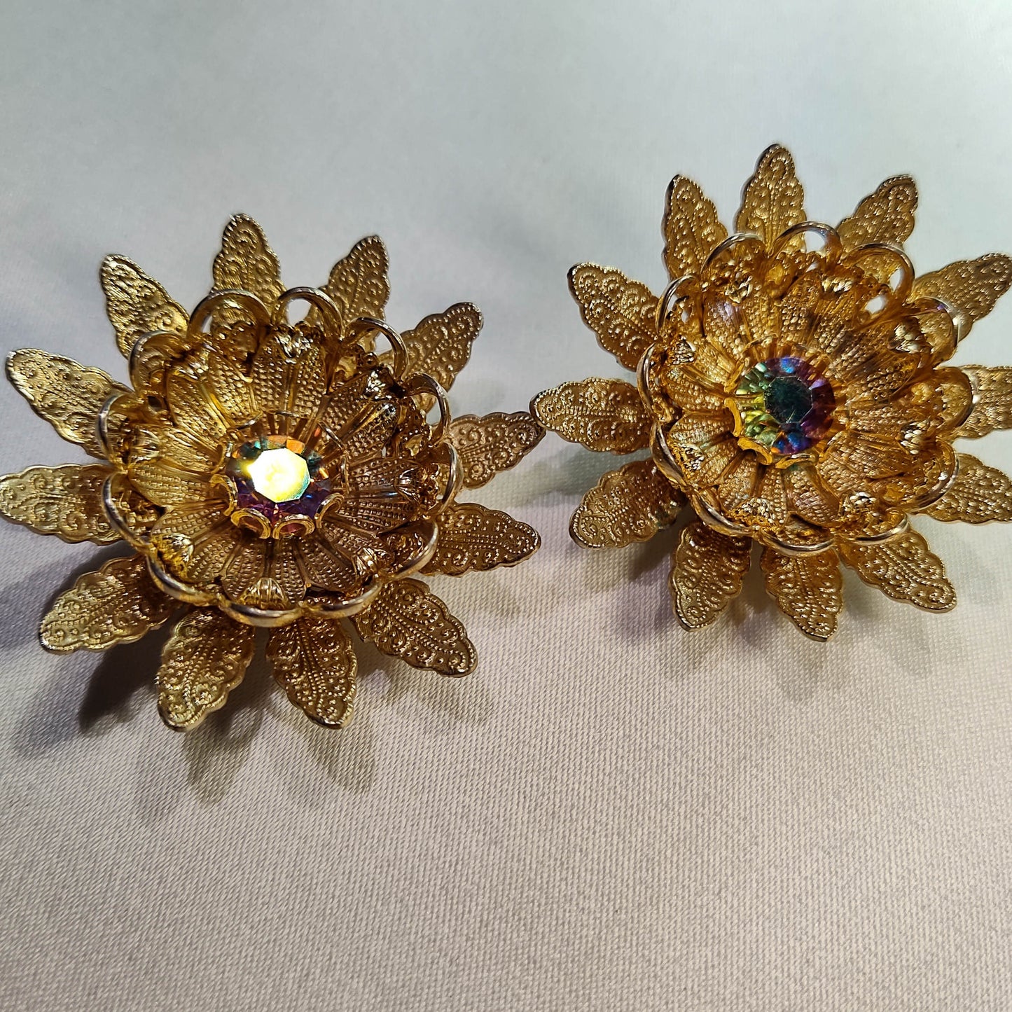 1960's Gold Tone Filigree Flower Clip Earrings with an Aurora Borealis Center