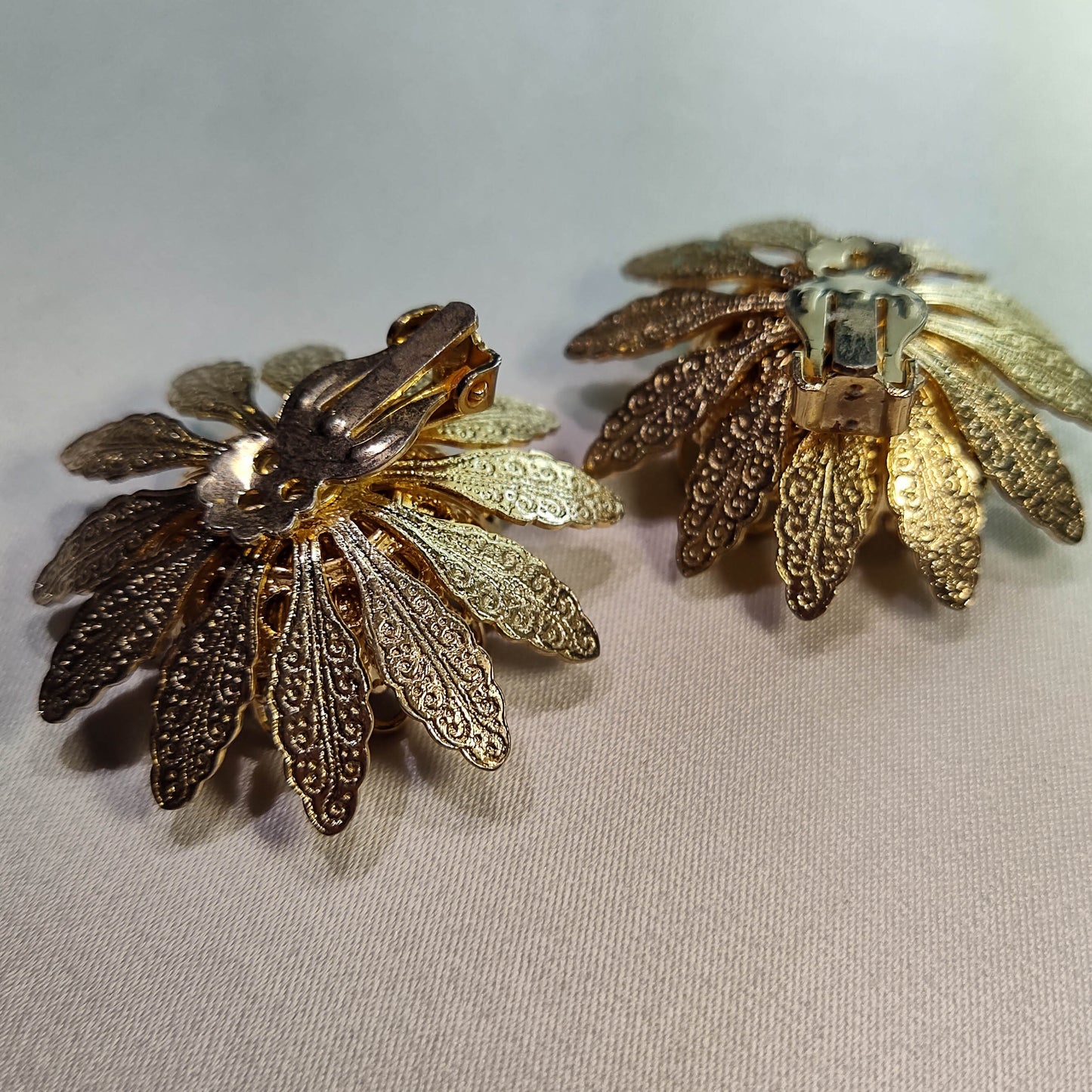 1960's Gold Tone Filigree Flower Clip Earrings with an Aurora Borealis Center