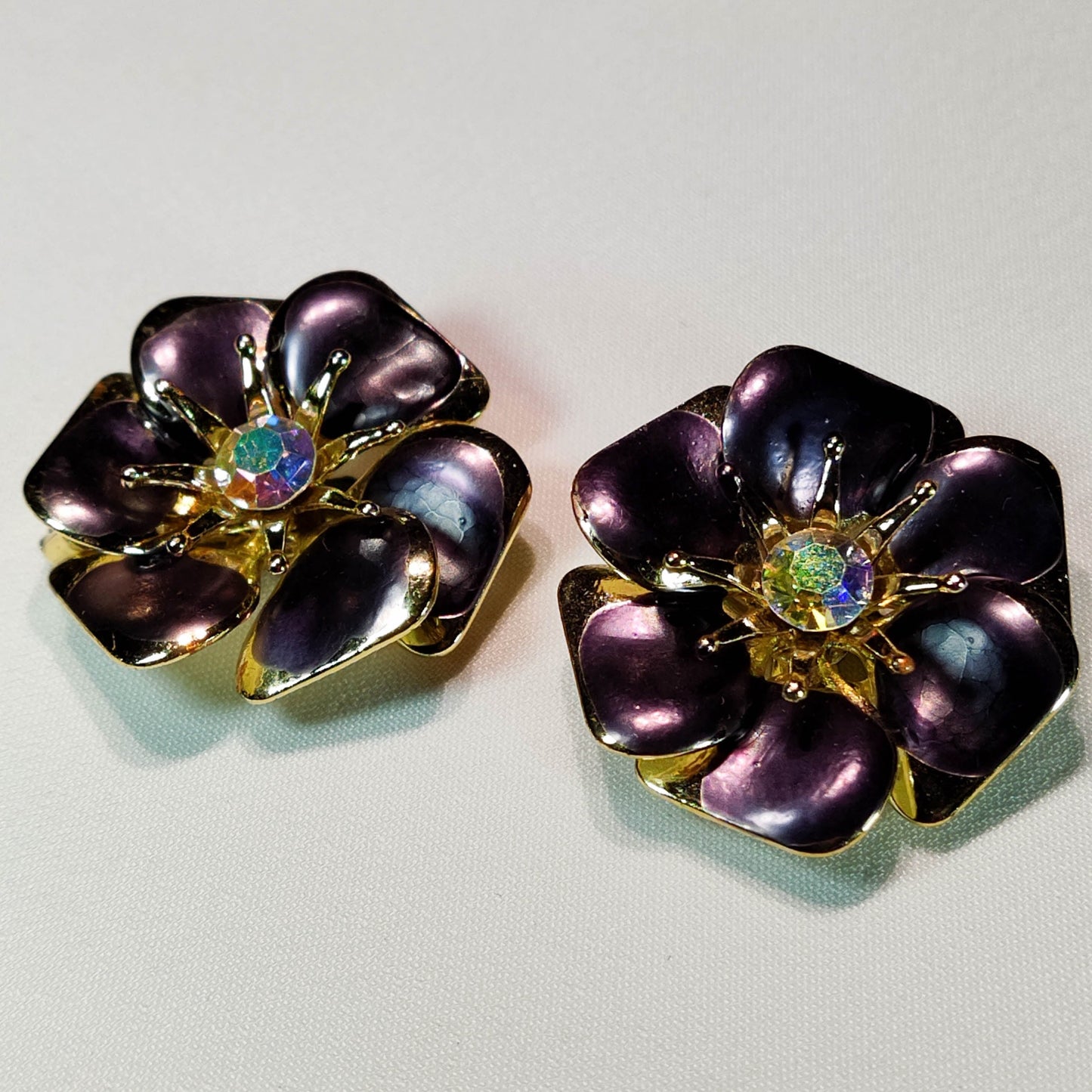 1960's Purple Metal Flower Clip Earrings with an Aurora Borealis Center