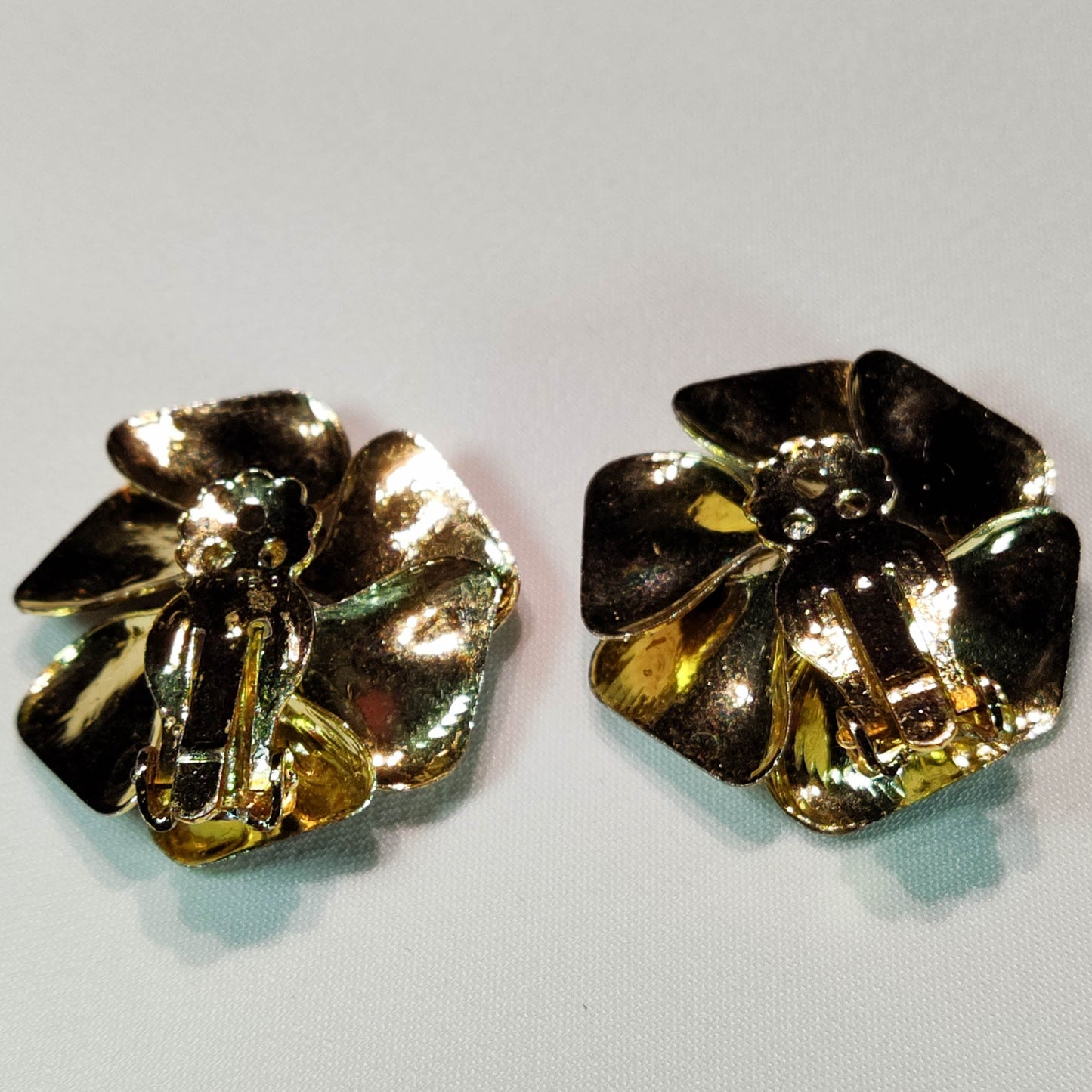 1960's Purple Metal Flower Clip Earrings with an Aurora Borealis Center