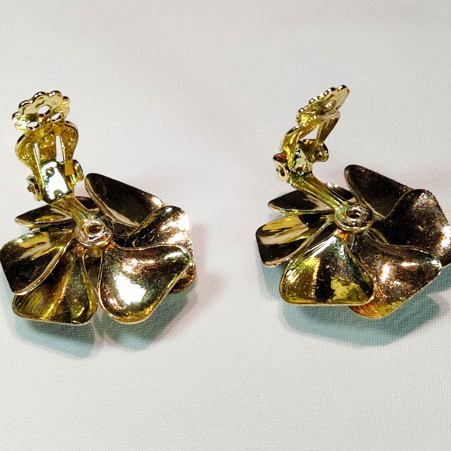 1960's Purple Metal Flower Clip Earrings with an Aurora Borealis Center