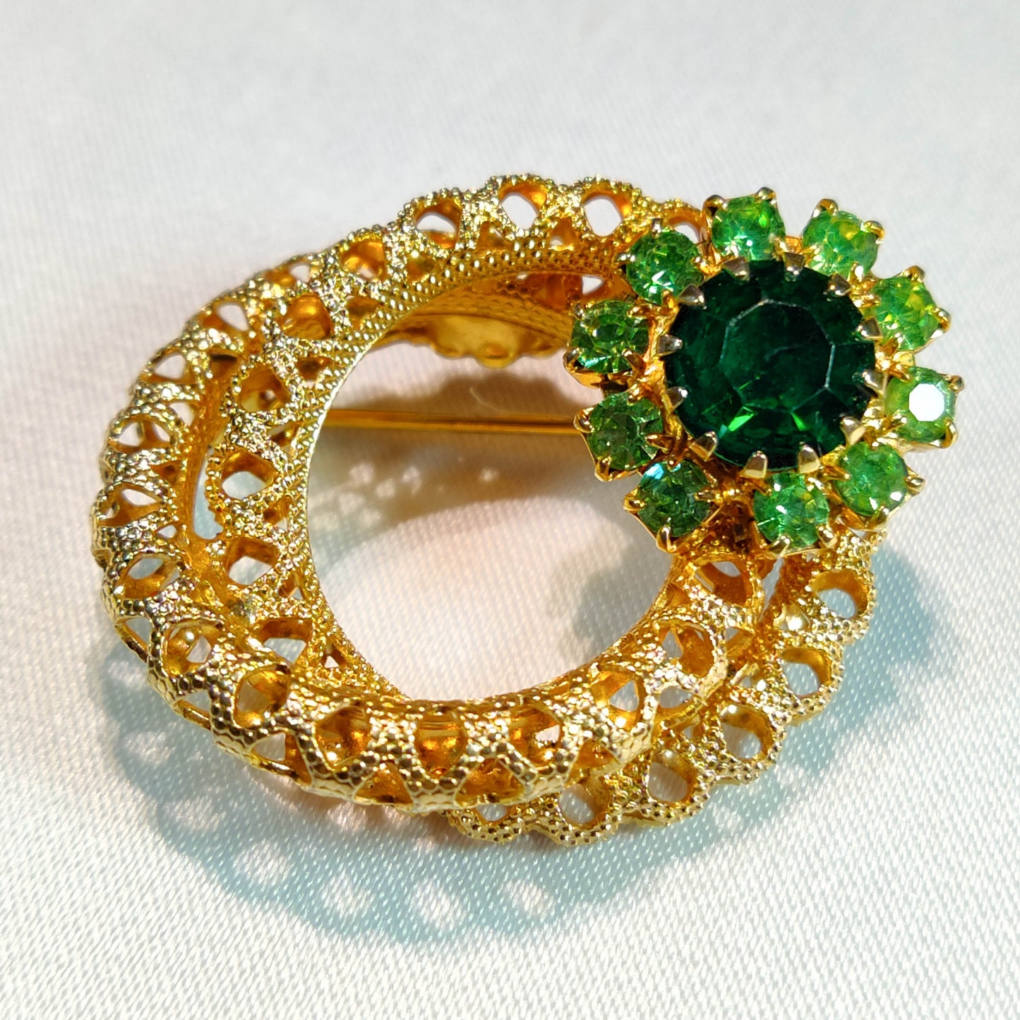 1960's Gold Metal Filigree and Green Rhinestone Pin