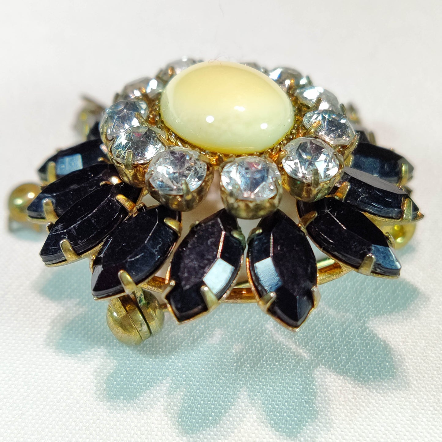 1930's Gold and Black Rhinestone Flower Dangle Pin with a Milkstone Center