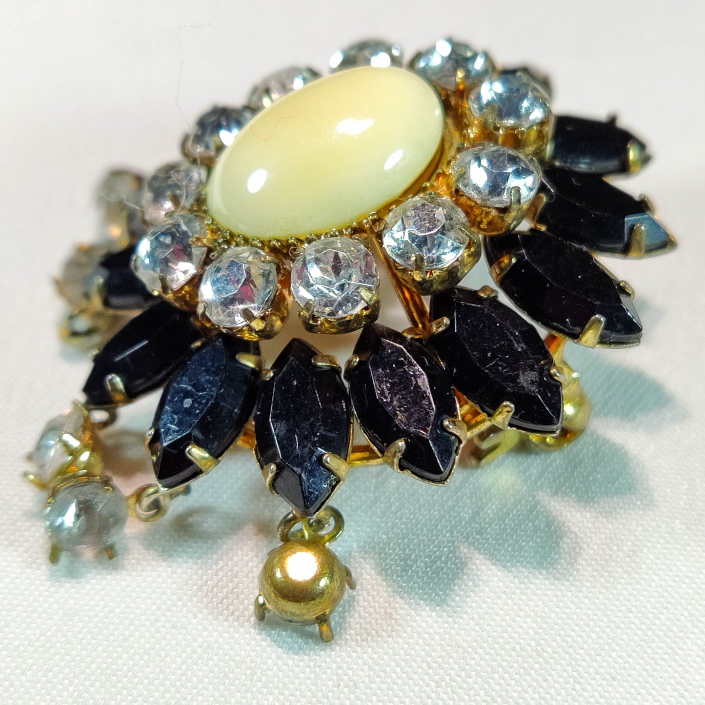 1930's Gold and Black Rhinestone Flower Dangle Pin with a Milkstone Center